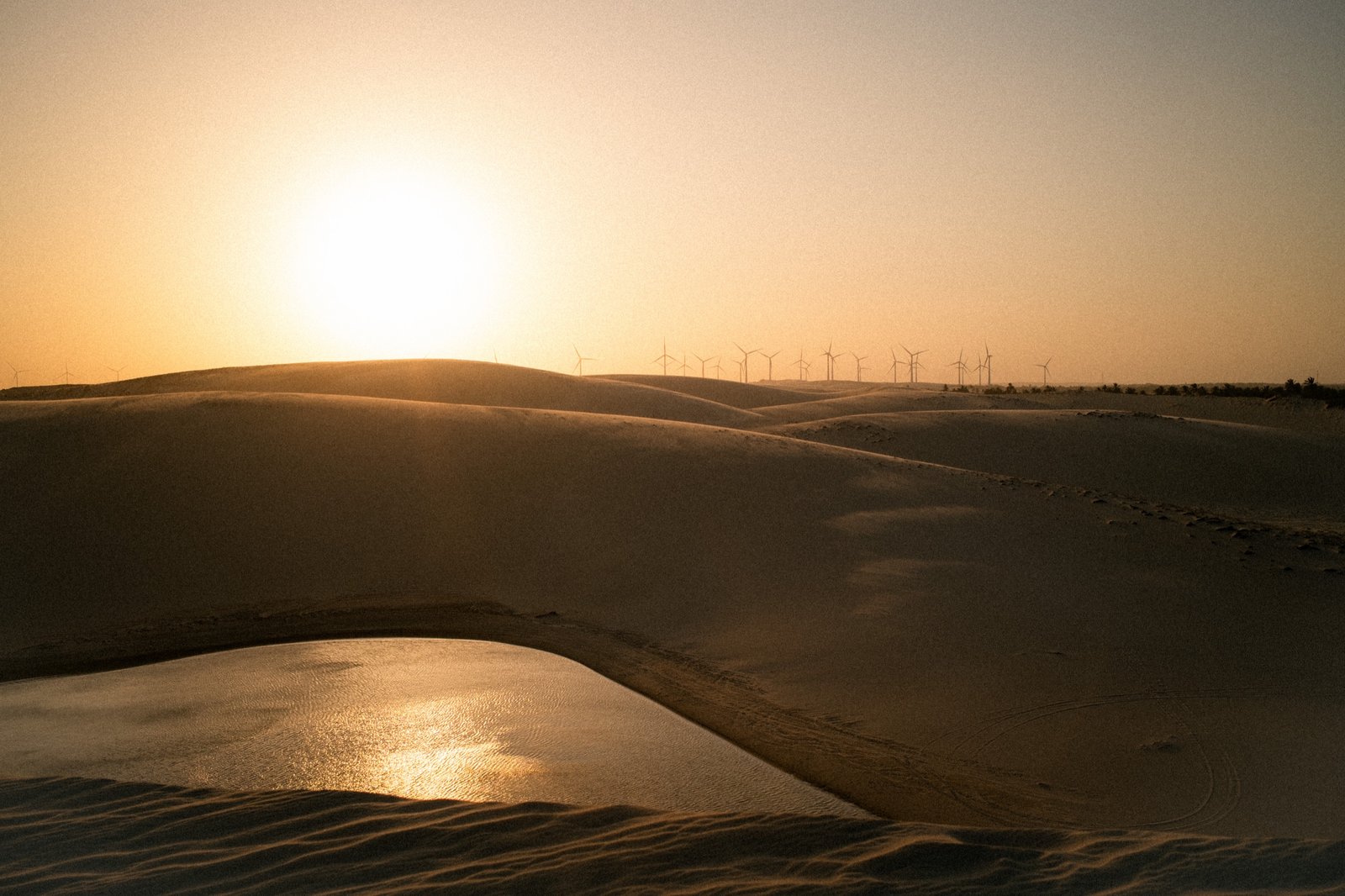 Golden dunes and a lagoon along the Ceará coast at sunset, the downwinder landscape