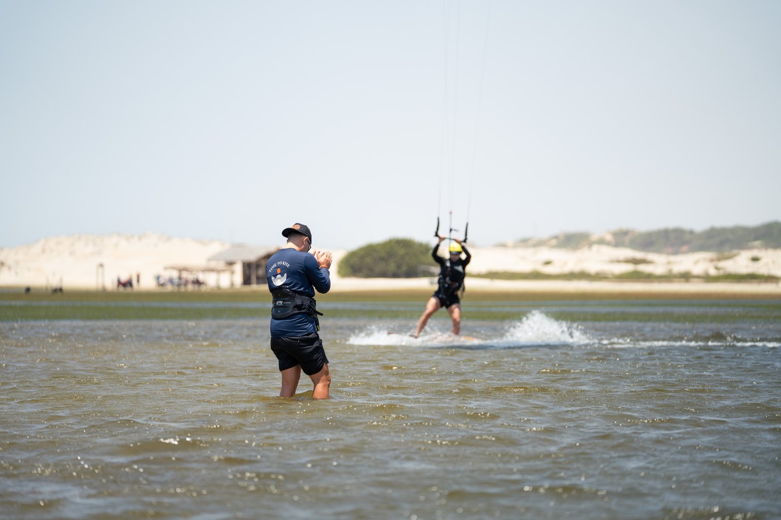 Student riding away on the board, first meters upwind
